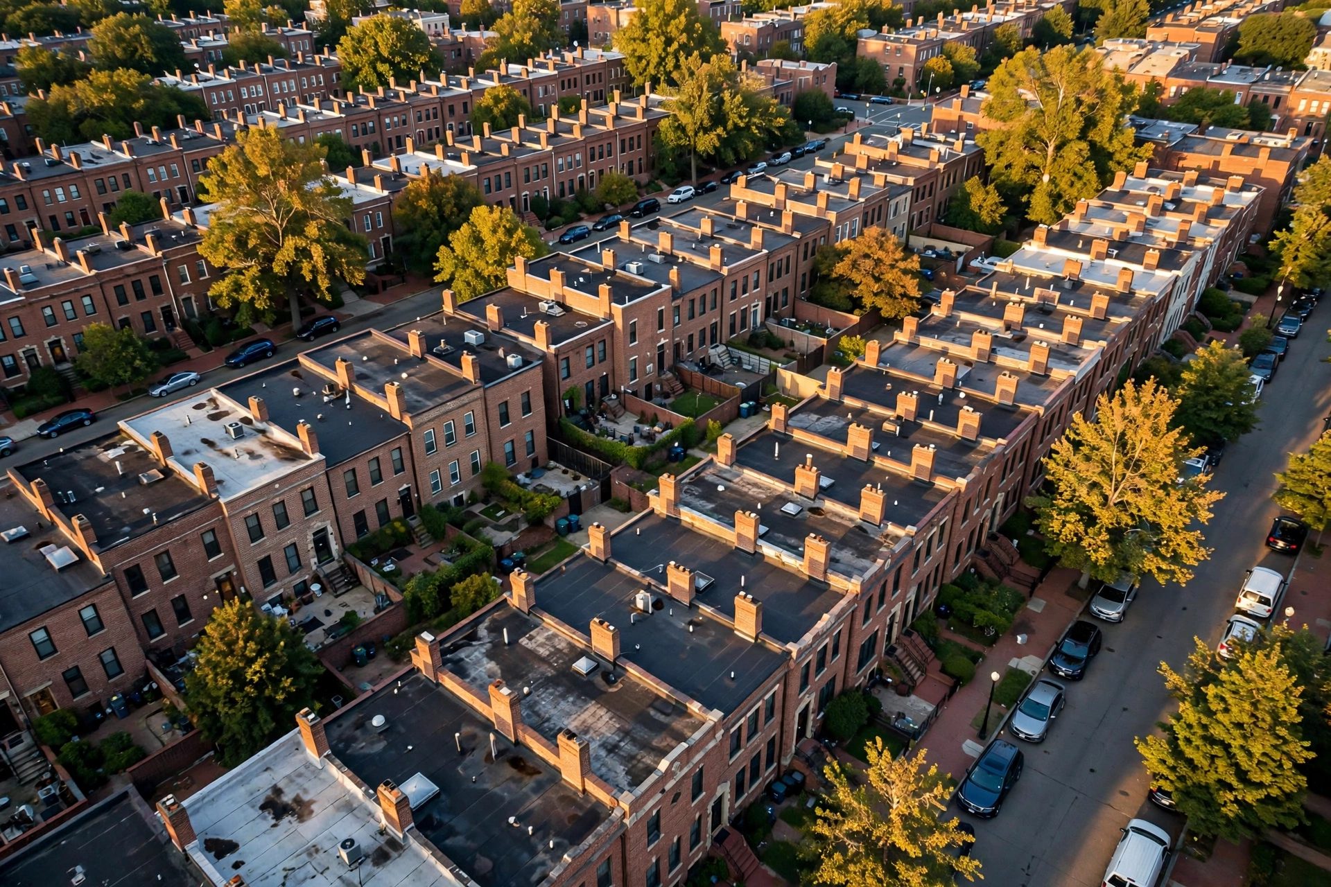 Aerial view of Washington, D.C. rowhouse rooftops served by Washington DC Roofers.